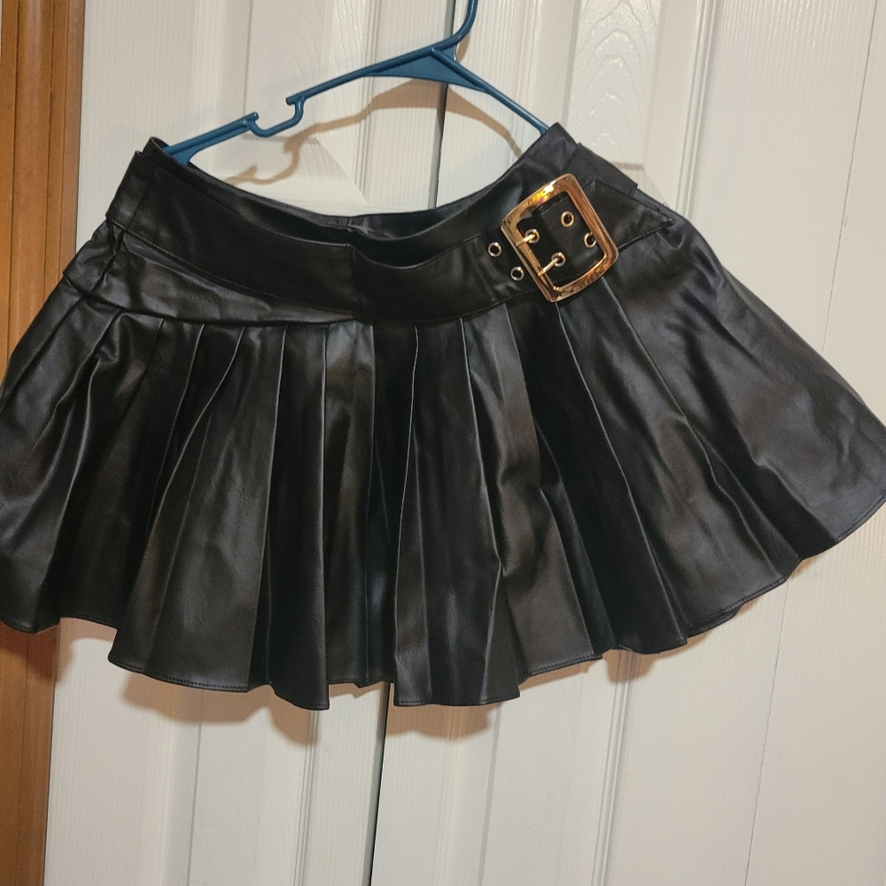 Black Pleated Skirt with Buckle Detail.